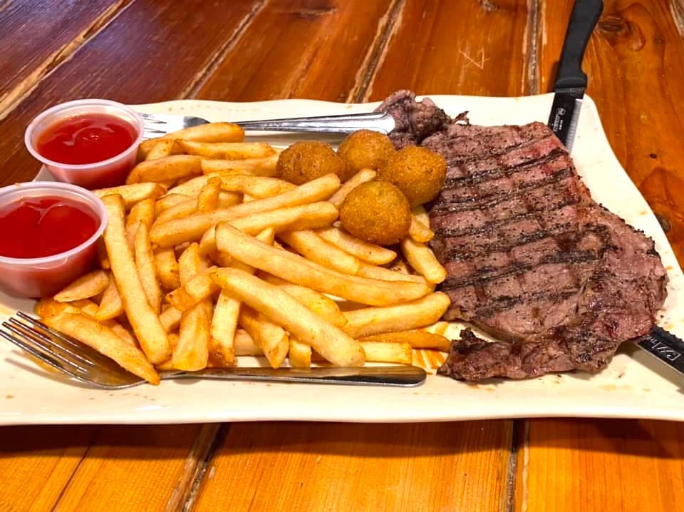 Ribeye steak with fries